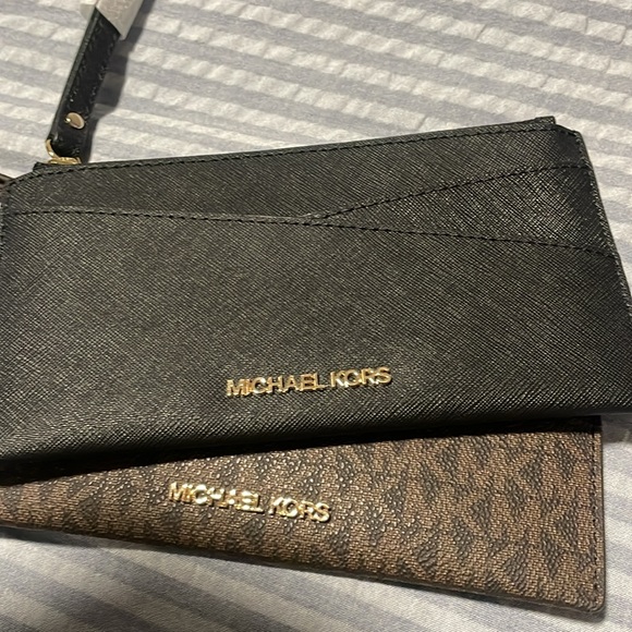 $50 EACH Michael Kors wristlet. Available in black, pink, and brown. - Picture 4 of 5